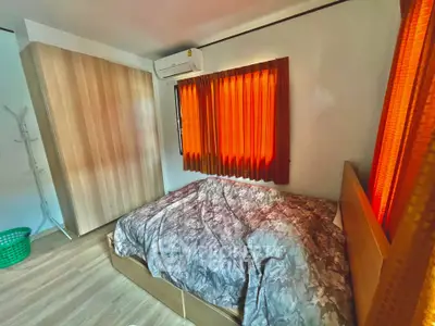 Cozy bedroom with warm lighting and modern furnishings