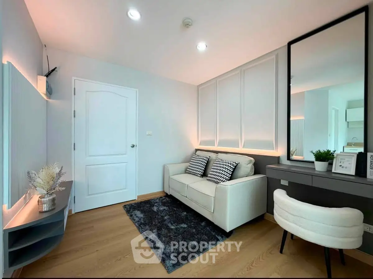 Modern living room with stylish decor and cozy seating area, perfect for relaxation and entertainment.