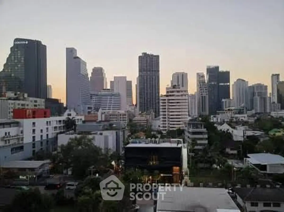 Stunning city skyline view with modern high-rise buildings at sunset.