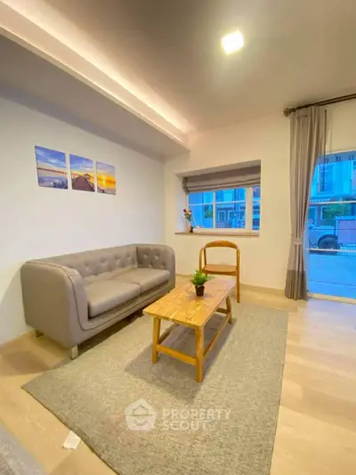 Charming living room with modern decor and cozy seating area.