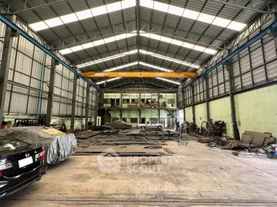 Spacious industrial warehouse with high ceilings and ample storage space.