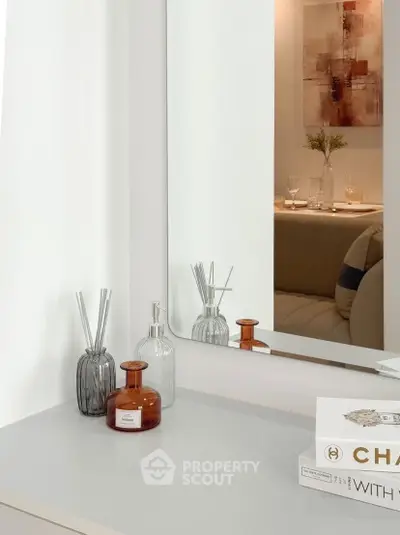 Stylish modern interior with decorative elements and mirror reflection