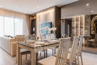 Luxurious open-plan living and dining area with elegant decor and modern furnishings.