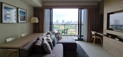 Modern living room with stunning city view from large balcony, featuring cozy seating and stylish decor.