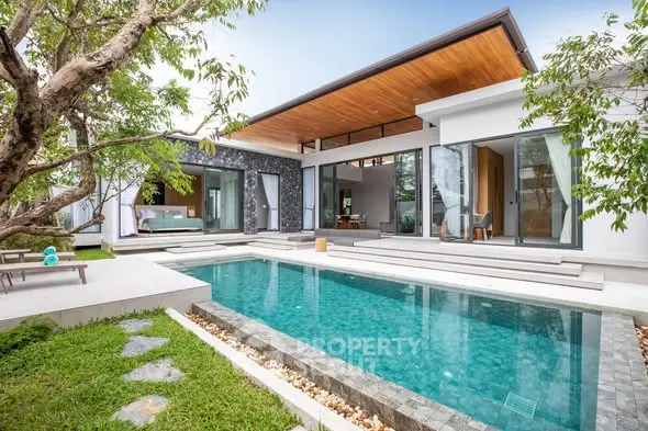 Luxurious modern villa with private pool and lush garden, perfect for serene living.