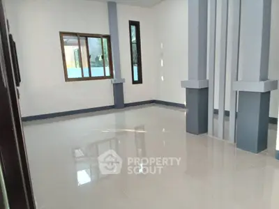 Spacious modern interior with large windows and sleek design