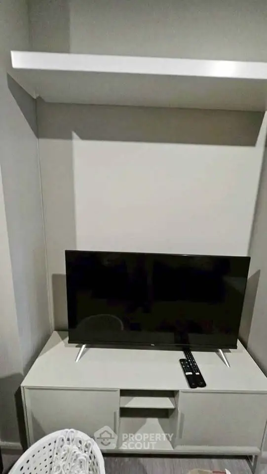 Modern living room with sleek TV setup and minimalist decor