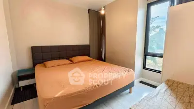 Cozy bedroom with large window and modern decor