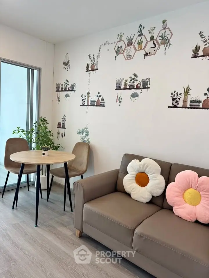 Charming living room with floral decor and cozy seating area, perfect for relaxation.