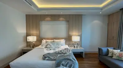 Luxurious modern bedroom with elegant lighting and cozy decor