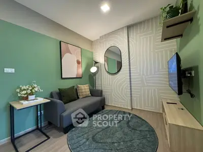 Stylish modern living room with green accent wall and cozy furniture