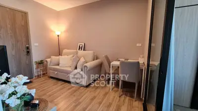 Cozy living room with modern decor and dining area in stylish apartment