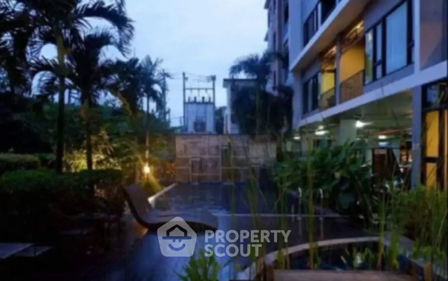 Luxurious apartment exterior with lush garden and modern design