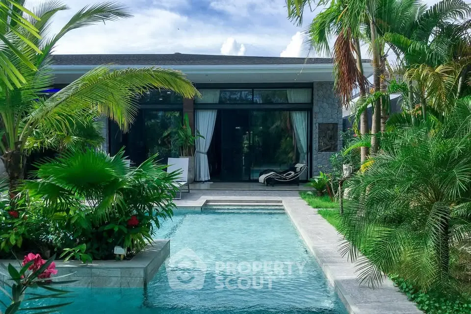 Luxurious tropical villa with private pool and lush garden, perfect for serene living.