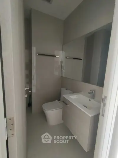 Modern minimalist bathroom with sleek fixtures and neutral tones