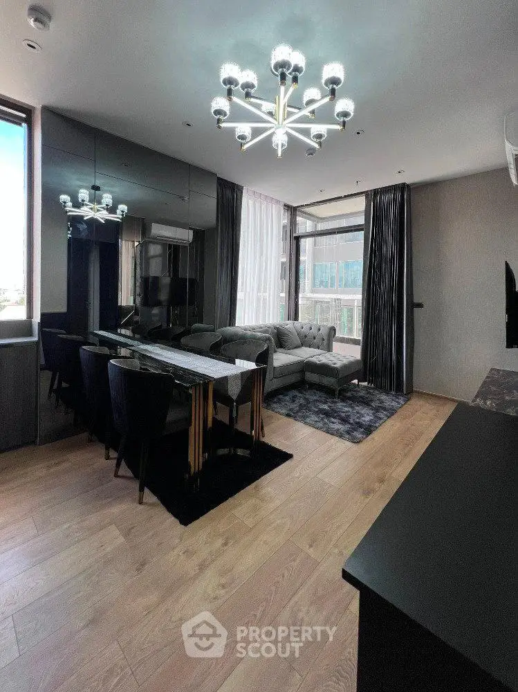 Luxurious modern living room with elegant chandelier and stylish furniture