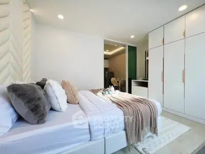 Luxurious modern bedroom with plush bedding and stylish decor