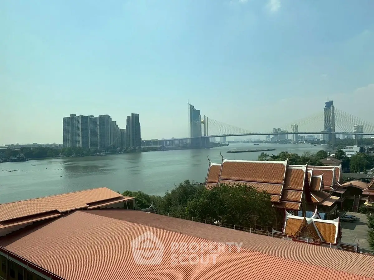 Stunning river view with modern high-rise buildings and traditional architecture.