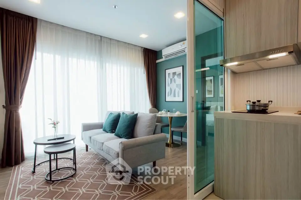 Modern living room with stylish decor and open kitchen layout