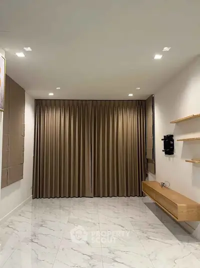 Spacious modern living room with elegant curtains and minimalist design