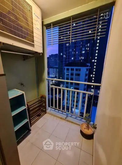 Charming balcony with cityscape view, perfect for relaxation and enjoying urban sunsets.