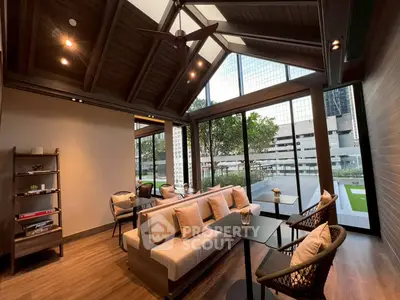 Luxurious living room with modern design and large windows offering city views