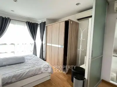 Cozy bedroom with modern wardrobe and natural light