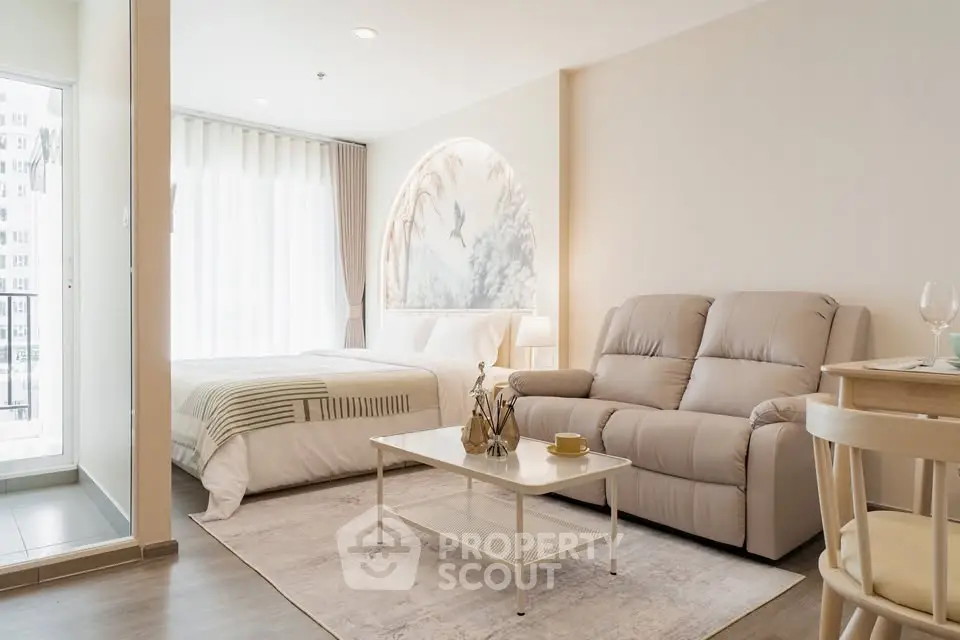Modern studio apartment with cozy living area and stylish decor
