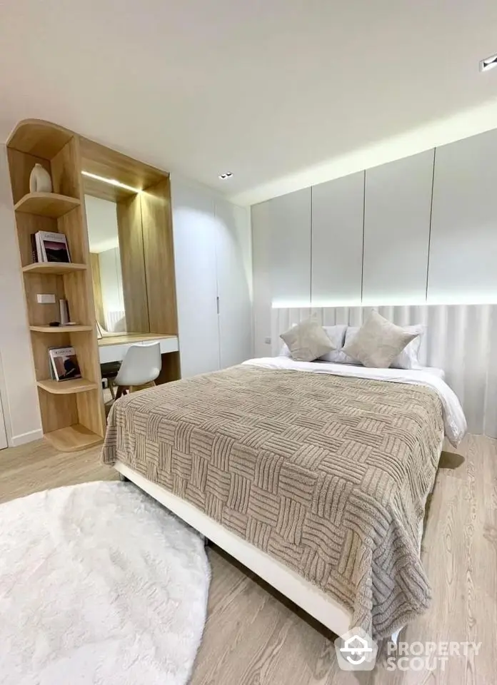 Modern bedroom with stylish decor and built-in storage solutions