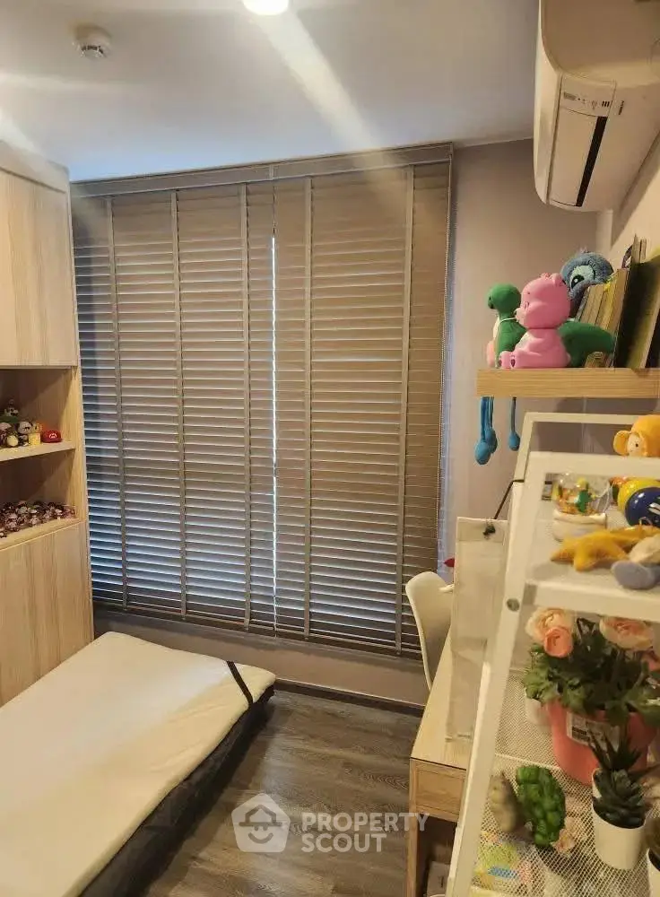 Cozy children's bedroom with wooden flooring and playful decor
