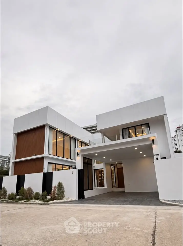 Modern luxury home exterior with sleek design and large windows