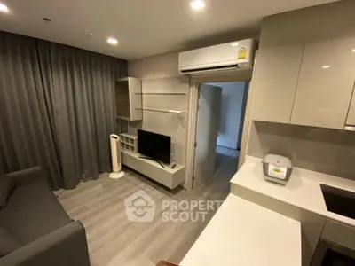 Modern living room with sleek furniture and air conditioning in a stylish apartment.