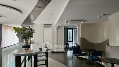 Stylish modern living area with elegant decor and seating, perfect for relaxation and socializing.