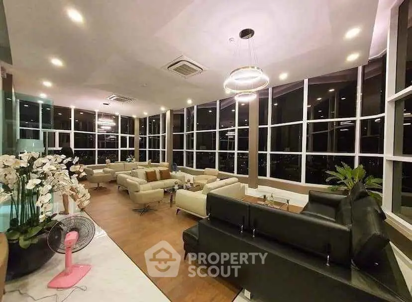 Luxurious modern living room with panoramic windows and elegant seating area