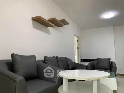 Modern living room with sleek gray sofas and minimalist decor