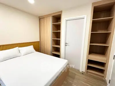 Modern bedroom with built-in wooden shelves and cozy bed