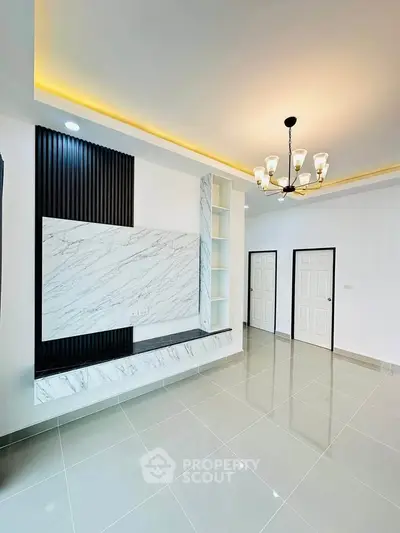 Modern living room with elegant marble accents and stylish lighting