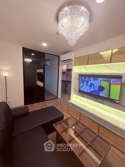 Luxurious living room with modern decor and elegant chandelier