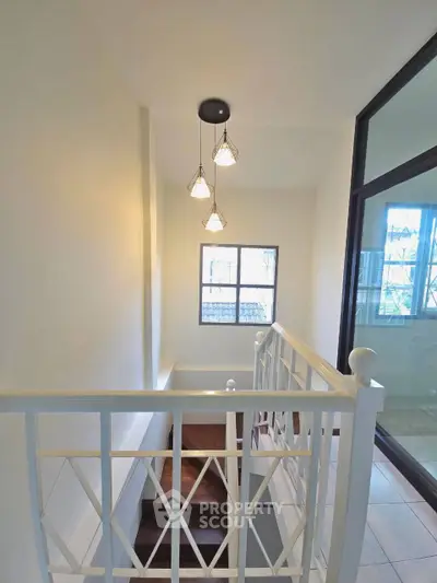 Bright stairway with elegant railing and modern lighting in a stylish home