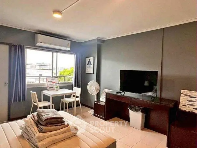 Cozy studio apartment with modern furnishings and natural light