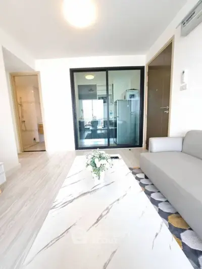 Modern living room with sleek design and open kitchen view