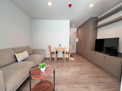 Modern living room with cozy sofa and dining area in stylish apartment