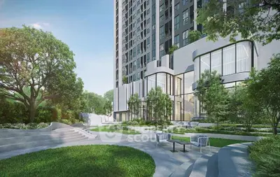 Modern high-rise building with lush landscaped garden and seating area.