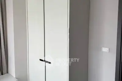 Modern minimalist wardrobe in a sleek apartment interior