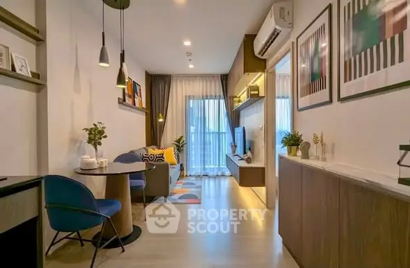 Modern living room with stylish decor and balcony view in a contemporary apartment.