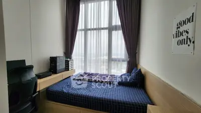 Modern bedroom with large window and stylish decor