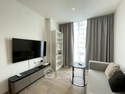 Modern living room with sleek TV setup and elegant furniture