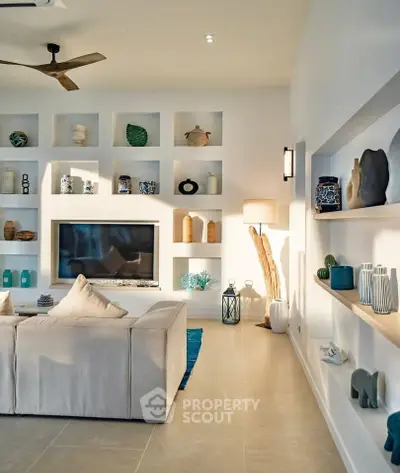 Luxurious living room with modern decor and built-in shelving, perfect for stylish living.