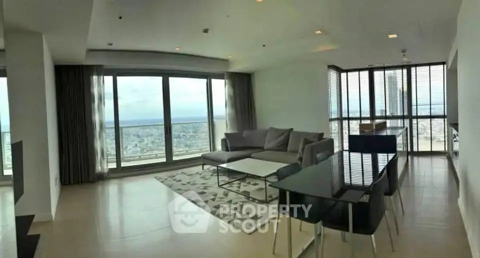 Spacious modern living room with panoramic city view and elegant furnishings