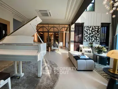 Luxurious living room with grand piano and modern decor, featuring elegant lighting and stylish furnishings.